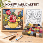 May include: A no-sew fabric art kit featuring a finished floral teacup design in a wooden frame, a black and white pattern template, 50 fabric squares measuring 10 x 10 cm, and three crafting tools including a stylus and small scissors.