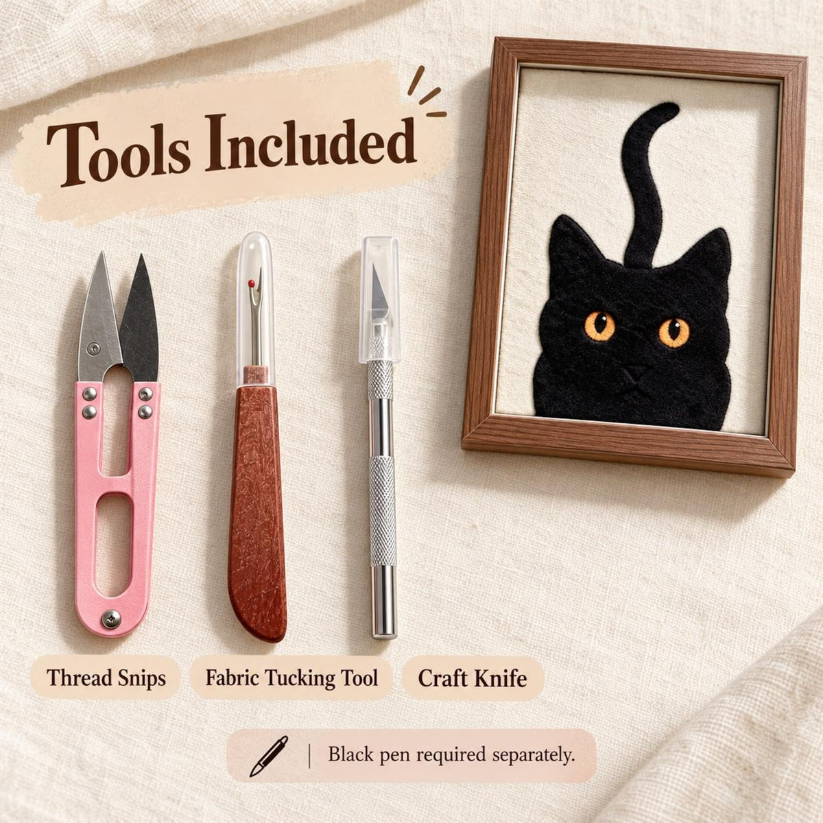 May include: A craft kit featuring pink thread snips, a wooden-handled fabric tucking tool, a silver craft knife, and a framed black cat embroidery. The text reads Tools Included and Black pen required separately.