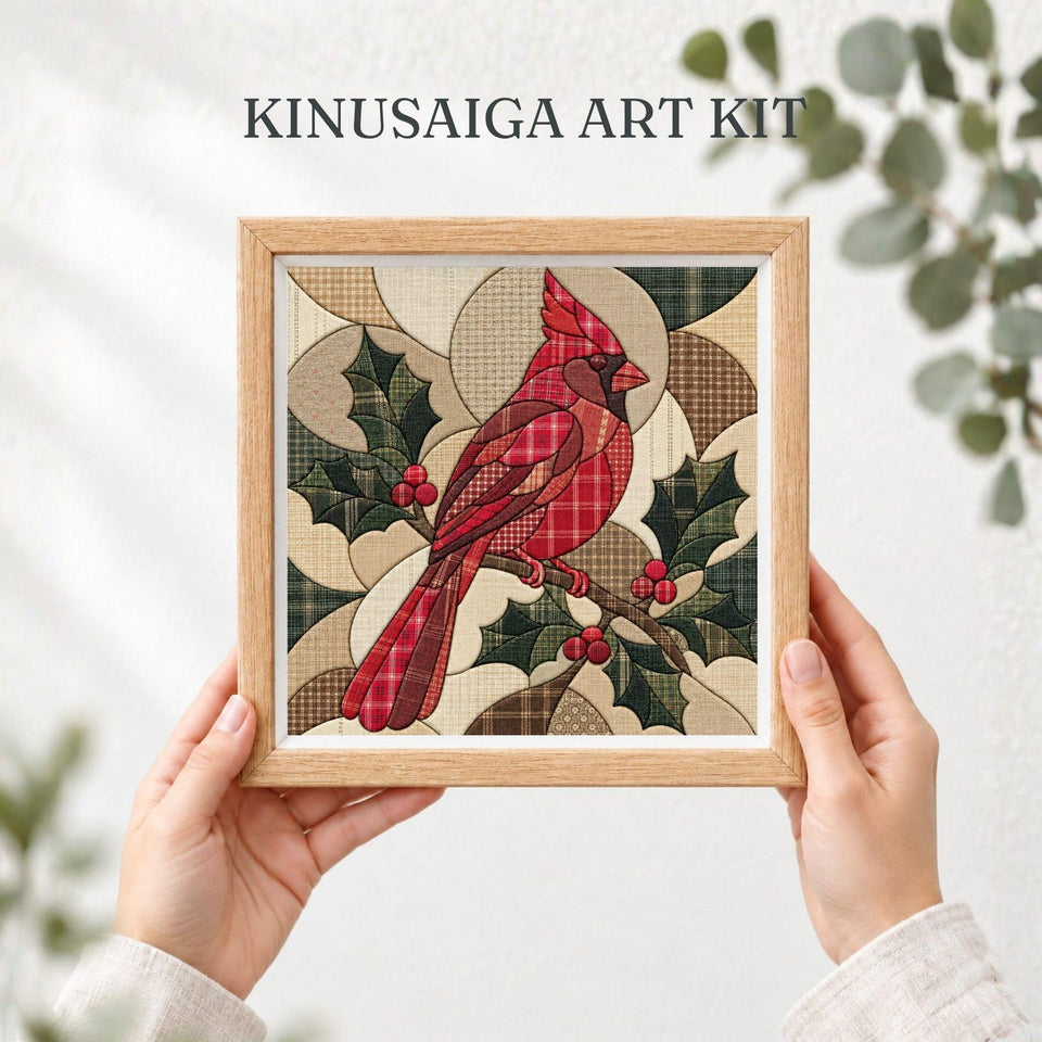 May include: A Kinusaiga art kit featuring a square wooden frame containing a fabric collage of a red cardinal bird perched on a branch with green holly leaves and red berries. The background consists of geometric shapes in beige and brown plaid.