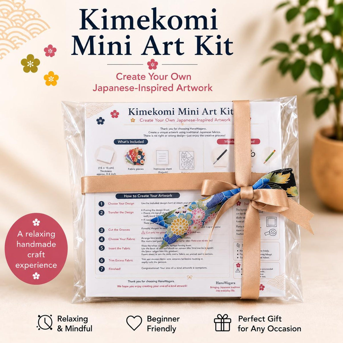 May include: A Kimekomi Mini Art Kit in clear plastic packaging, tied with a gold satin ribbon and a floral fabric accent. The kit includes instructions, fabric pieces, and a base, with text detailing the steps to create Japanese-inspired artwork.