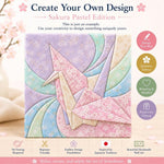 May include: A square Kimekomi craft kit featuring a central origami crane design in pastel pink, blue, and cream floral fabrics. The text reads Create Your Own Design, Sakura Pastel Edition, and includes icons for design, Japanese fabrics, and gifting.